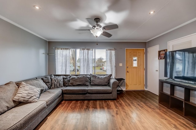 living room featuring crown molding, recessed lighting, wood-type flooring, and ceiling fan