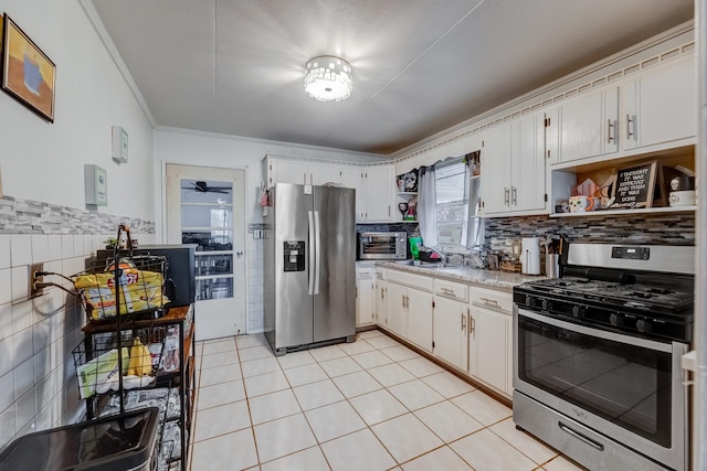 kitchen with crown molding, open shelves, light countertops, and stainless steel appliances