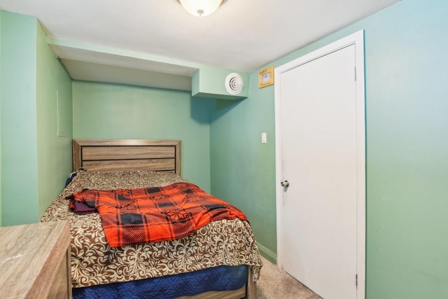 bedroom featuring baseboards and carpet flooring
