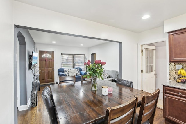dining room with recessed lighting and dark wood finished floors