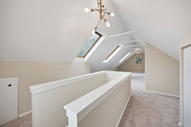 additional living space featuring carpet and vaulted ceiling with skylight