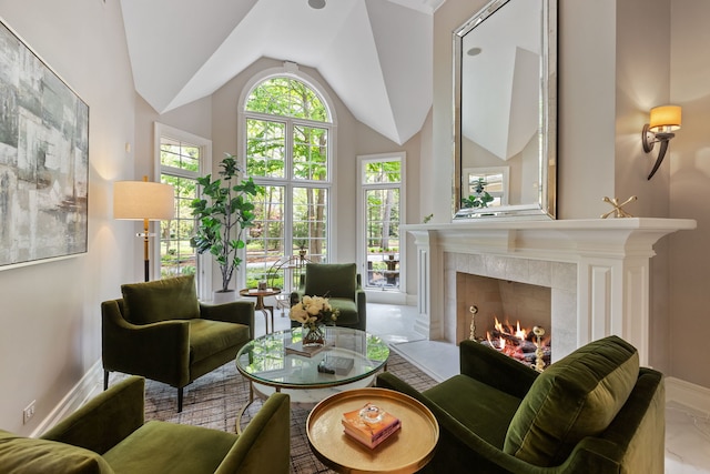 2S546 Heaton Dr, Batavia, IL 60510 - sitting room featuring a tile fireplace, vaulted ceiling, and baseboards