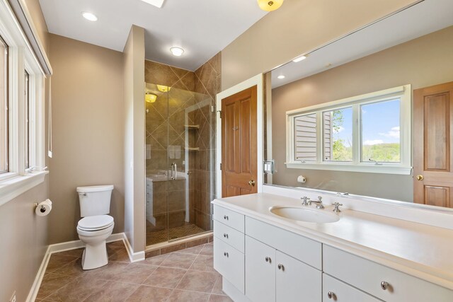 2S546 Heaton Dr, Batavia, IL 60510 - bathroom featuring toilet, a shower stall, vanity, baseboards, and tile patterned flooring