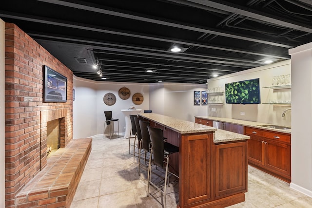 2S546 Heaton Dr, Batavia, IL 60510 - indoor bar with a fireplace, light tile patterned flooring, and baseboards