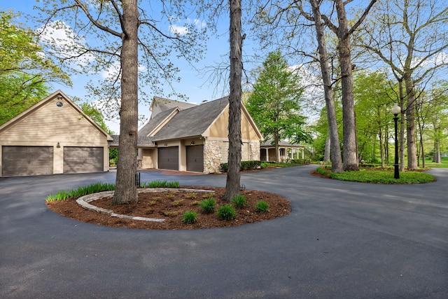2S546 Heaton Dr, Batavia, IL 60510 - view of front of property featuring stone siding, asphalt driveway, and a garage