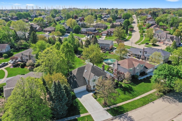 aerial view of property and surrounding area with nearby suburban area