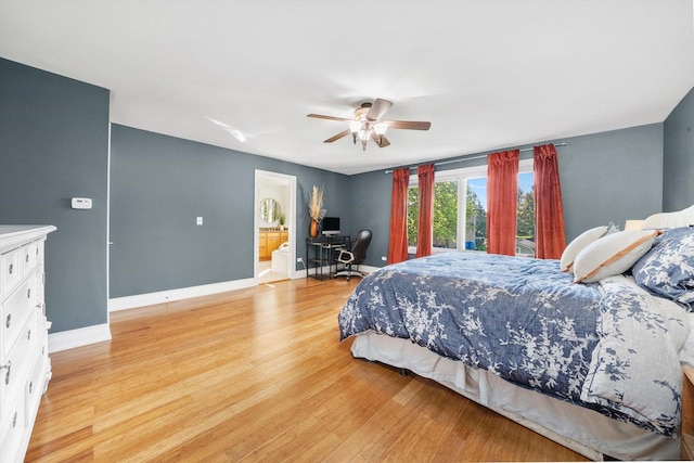 bedroom featuring light wood-style flooring, an office area, baseboards, and ceiling fan