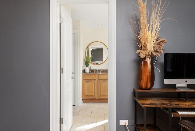 hallway featuring a sink