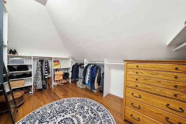 spacious closet featuring wood finished floors and lofted ceiling
