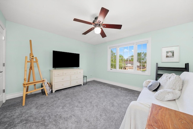 carpeted bedroom featuring baseboards and ceiling fan