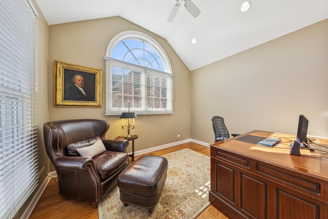 office with ceiling fan, vaulted ceiling, and light wood finished floors