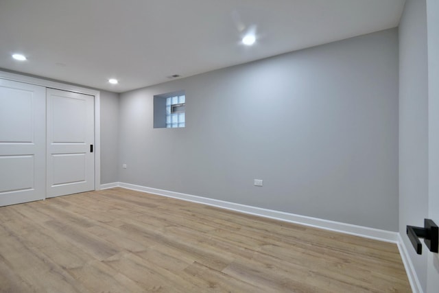 basement with recessed lighting, baseboards, and light wood finished floors