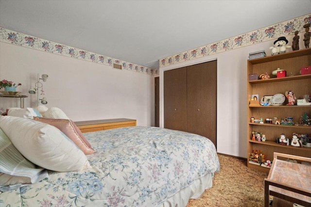 bedroom with a closet and light colored carpet