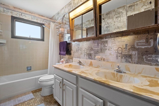 full bathroom featuring toilet, tile patterned flooring, shower / bath combo with shower curtain, and double vanity
