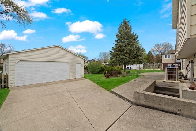 detached garage featuring cooling unit