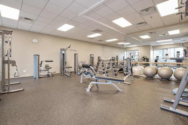 workout area with visible vents and a drop ceiling