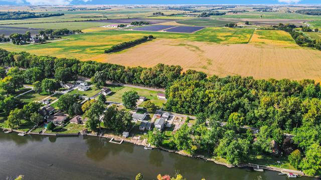 bird's eye view with a water view and a rural view