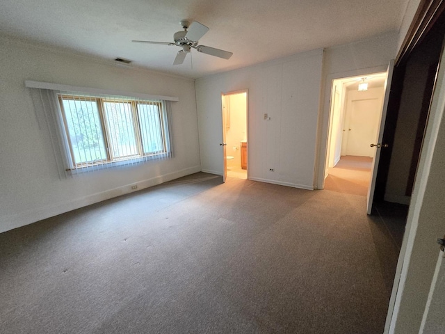 8401 W 129th St, Palos Park, IL 60464 - unfurnished bedroom with visible vents, carpet floors, baseboards, ceiling fan, and ensuite bath