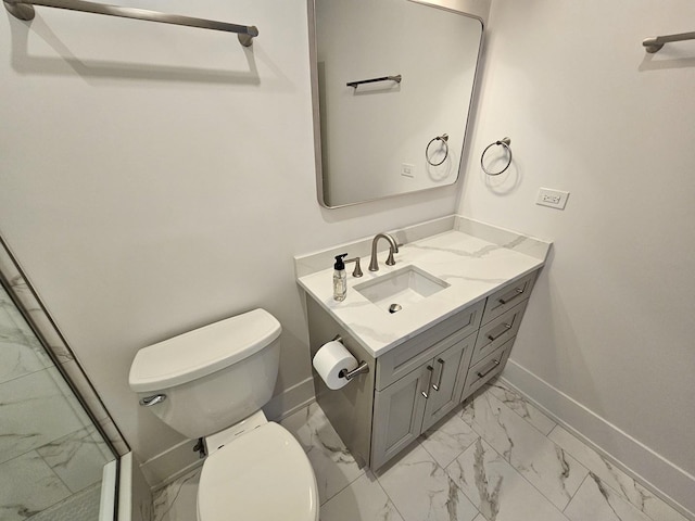bathroom with toilet, baseboards, marble finish floor, and vanity