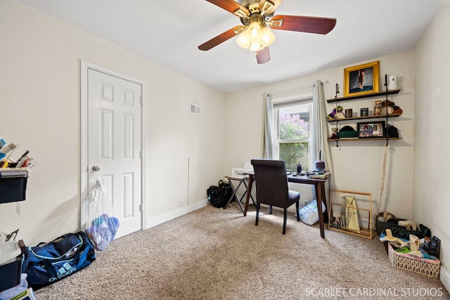 office area featuring baseboards, ceiling fan, carpet, and visible vents