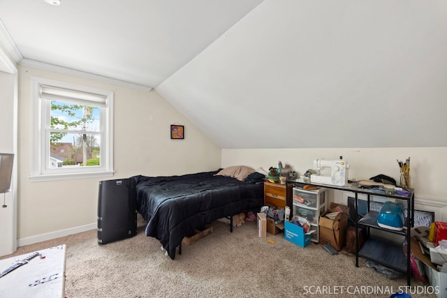 carpeted bedroom featuring baseboards and vaulted ceiling