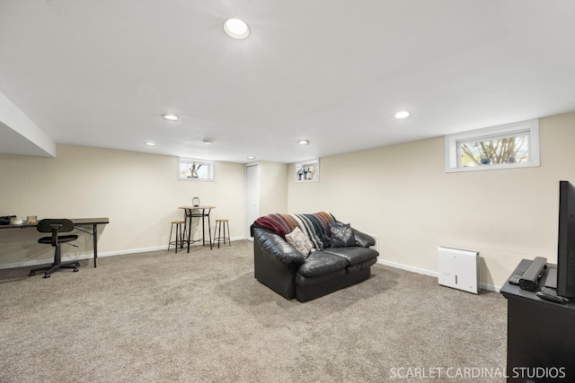 carpeted living area featuring recessed lighting and baseboards