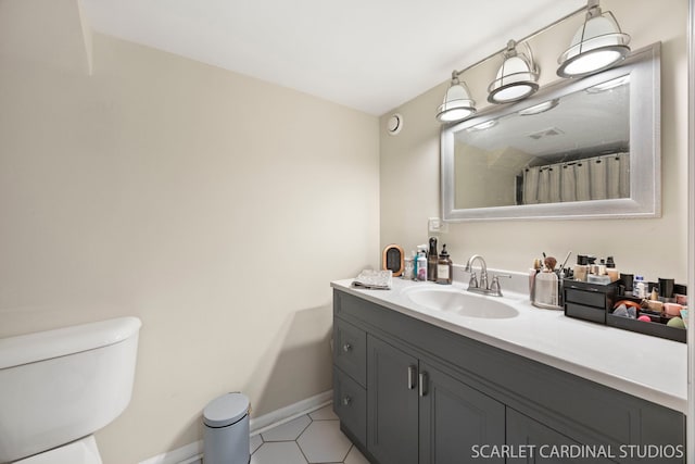 full bathroom featuring visible vents, tile patterned flooring, vanity, baseboards, and toilet