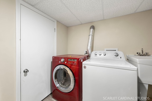 laundry room featuring laundry area, a sink, and independent washer and dryer