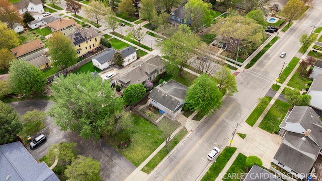 birds eye view of property with a residential view