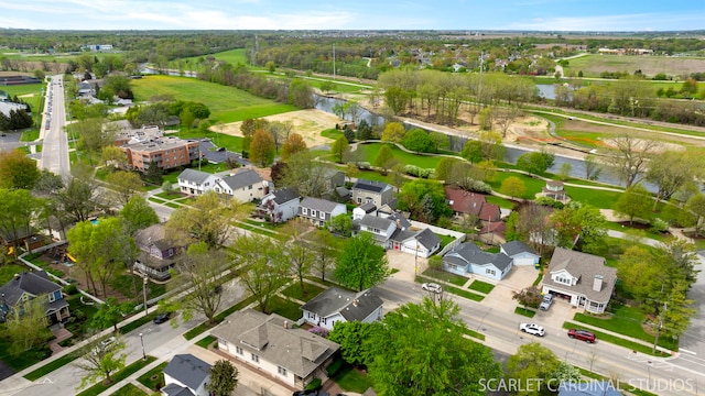 bird's eye view with a water view and a residential view