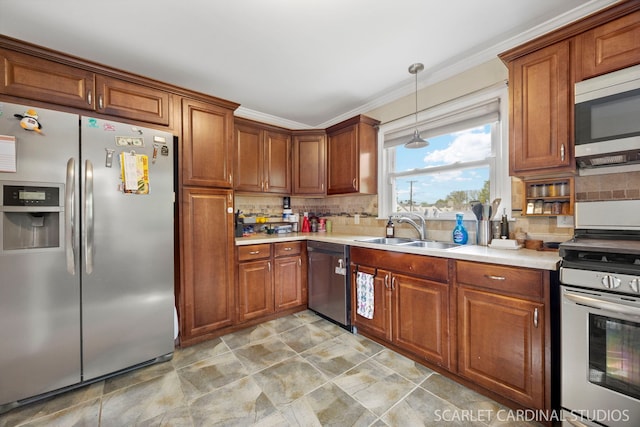 kitchen with a sink, light countertops, stainless steel appliances, and brown cabinets