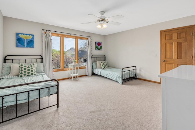 bedroom with baseboards, light colored carpet, and ceiling fan