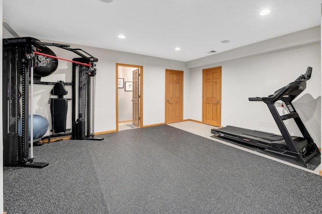 exercise area with recessed lighting and baseboards