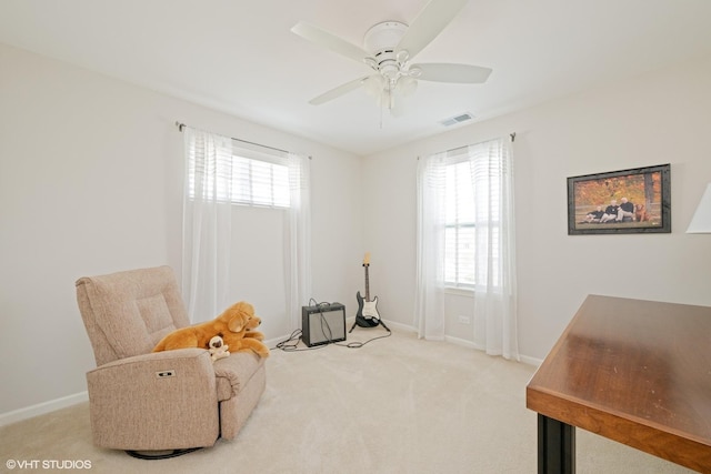 sitting room with baseboards, ceiling fan, carpet, and visible vents
