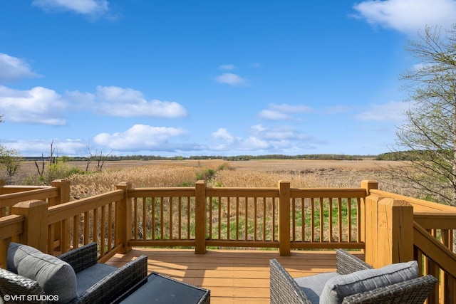 wooden terrace with a rural view