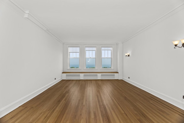 3300 N Lake Shore Dr Unit 12B, Chicago, IL 60657 - unfurnished room with ornamental molding, wood finished floors, baseboards, and a chandelier