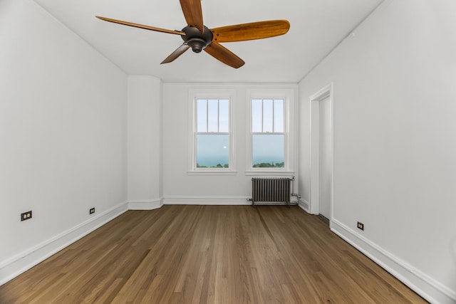 3300 N Lake Shore Dr Unit 12B, Chicago, IL 60657 - empty room featuring radiator, wood finished floors, a ceiling fan, and baseboards