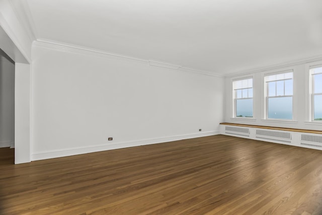 3300 N Lake Shore Dr Unit 12B, Chicago, IL 60657 - unfurnished room with crown molding, dark wood-type flooring, and baseboards
