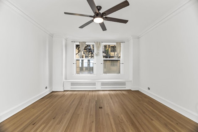 3300 N Lake Shore Dr Unit 12B, Chicago, IL 60657 - spare room featuring crown molding, a ceiling fan, wood finished floors, and baseboards