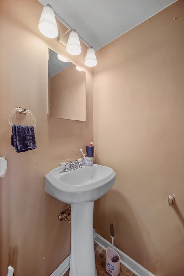 114 Pilgrim Ct, Bolingbrook, IL 60440 - bathroom featuring baseboards and a sink