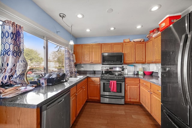 114 Pilgrim Ct, Bolingbrook, IL 60440 - kitchen with stainless steel appliances, dark wood finished floors, a sink, recessed lighting, and hanging light fixtures