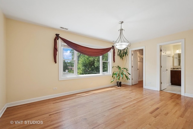 8712 N Central Ave, Morton Grove, IL 60053 - spare room featuring light wood finished floors and baseboards