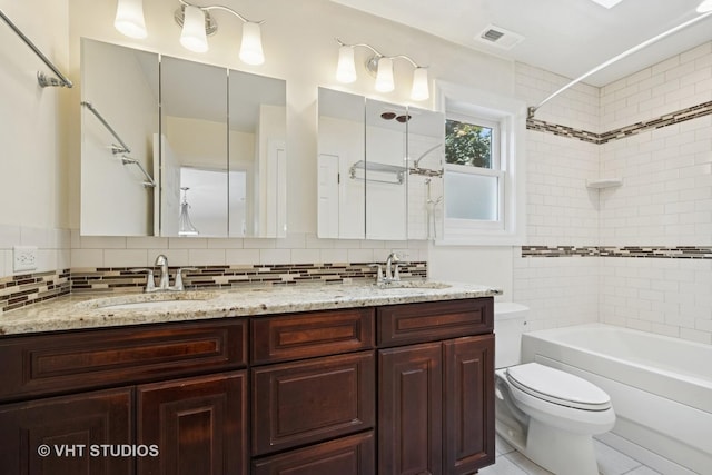 8712 N Central Ave, Morton Grove, IL 60053 - full bathroom featuring double vanity, tub / shower combination, backsplash, and tile patterned flooring