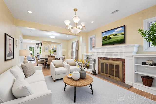 8712 N Central Ave, Morton Grove, IL 60053 - living area featuring wood finished floors, a fireplace, a chandelier, and recessed lighting