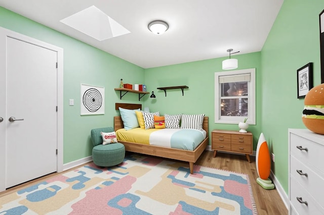 8712 N Central Ave, Morton Grove, IL 60053 - bedroom with a skylight and light wood-style flooring