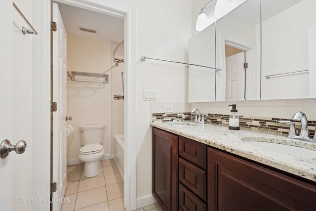 8712 N Central Ave, Morton Grove, IL 60053 - bathroom with double vanity, decorative backsplash, tile patterned flooring, and shower / washtub combination
