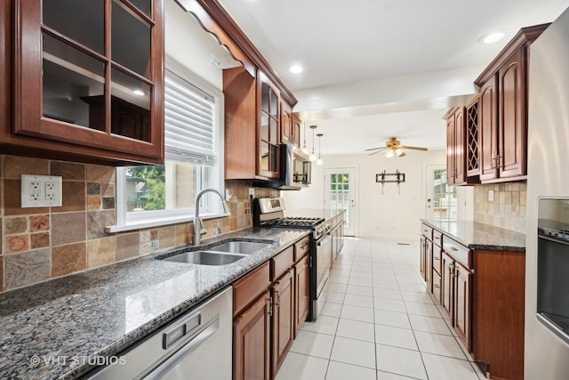 8712 N Central Ave, Morton Grove, IL 60053 - kitchen with stainless steel gas range oven, ceiling fan, refrigerator with ice dispenser, light tile patterned flooring, and backsplash