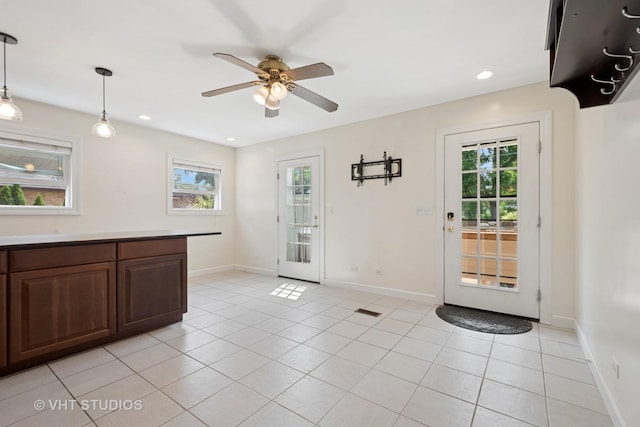 8712 N Central Ave, Morton Grove, IL 60053 - kitchen with light tile patterned flooring, ceiling fan, decorative light fixtures, recessed lighting, and light countertops