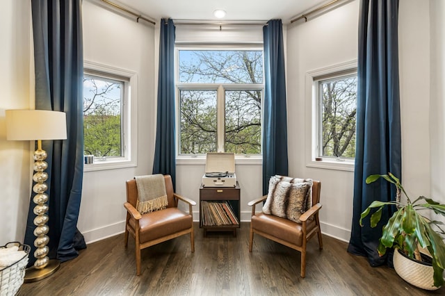 sitting room featuring baseboards and wood finished floors