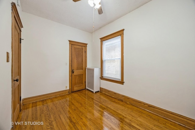 1521 Cuyler Ave, Berwyn, IL 60402 - empty room with wood finished floors, a ceiling fan, and baseboards